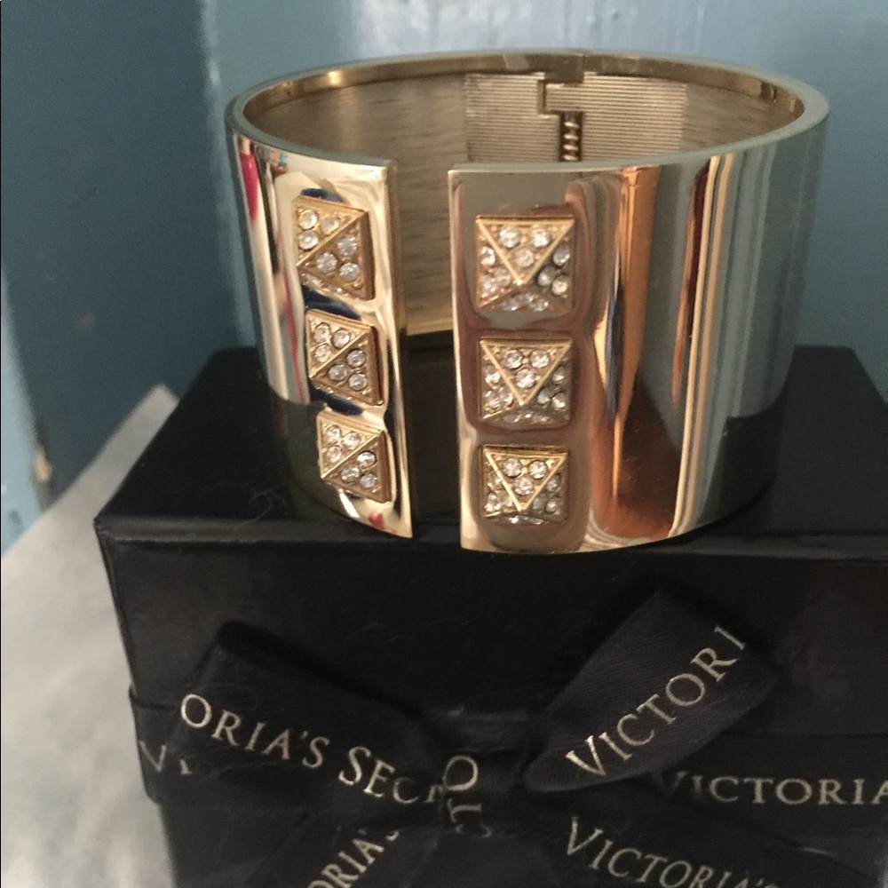 Gold studded cuff bracelet.
